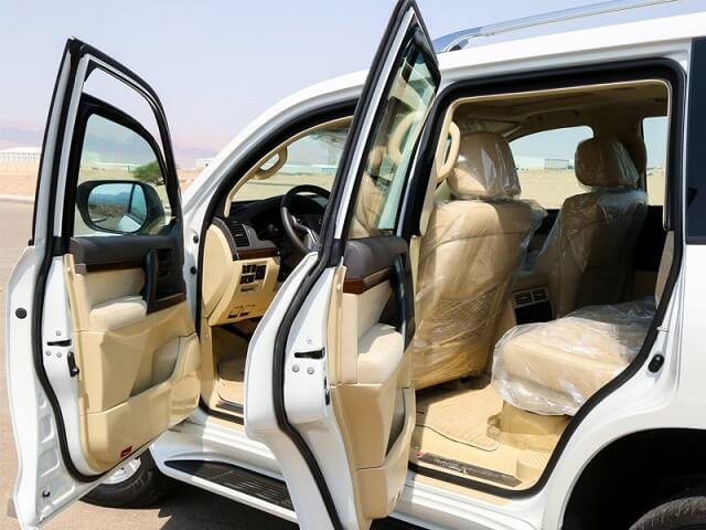 white Armored Land Cruiser side doors open